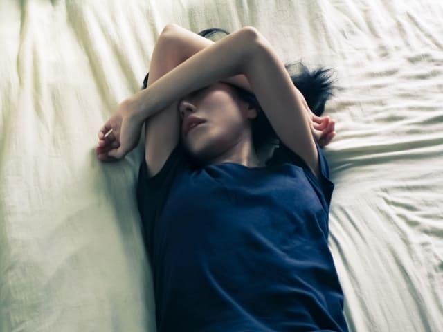 辛そうな女性